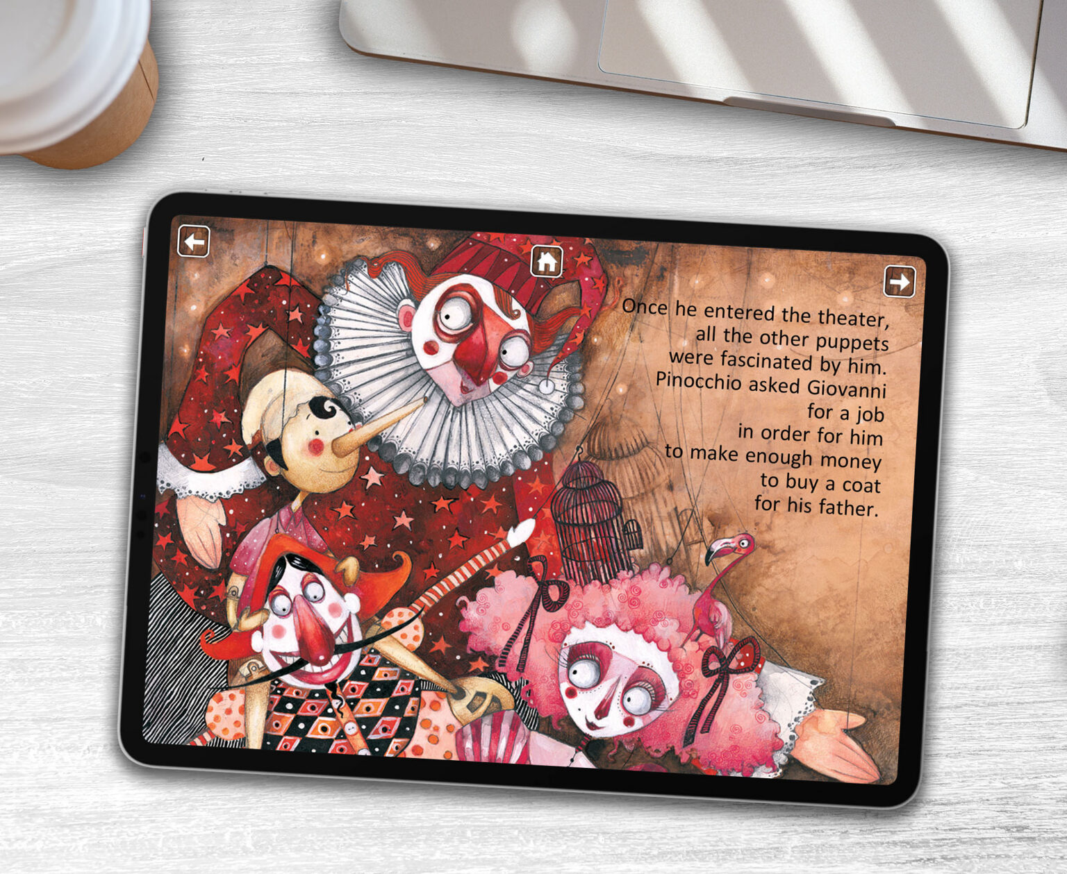 Pinocchio interactive storytelling app by Minoas Editions displayed on an iPad on a white desk, showing illustrated spread with puppet characters
